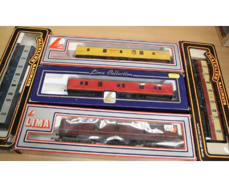 Five Bogie Parcels vans, Mainline blue/grey and crimson/cream, Lima maroon/red and Theakstons yellow. P&amp;P Group 1 (£14+VA