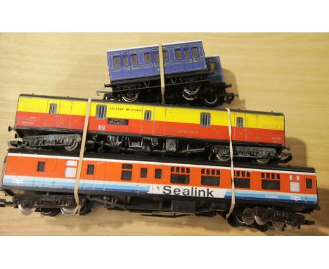 Six OO scale coaches including Hornby, Thomas Coach, and two four wheel blue Lima, Sealink, Theakstons and Satlink Western. P