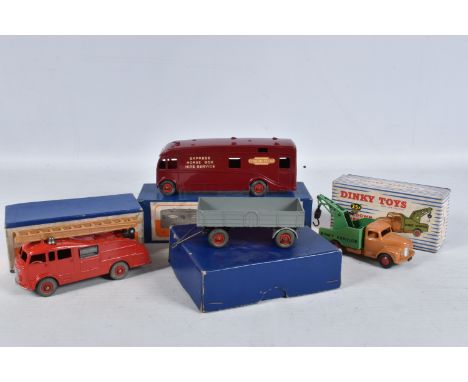 FOUR BOXED DINKY TOYS DIE-CAST MODELS, the first a Fire Engine with Extending Ladder no.555, red body with a tan/brown colour