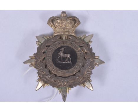 EARLY TWENTIETH CENTURY ROYAL WARWICKSHIRE HELMET PLATE, this features the antelope on a black background and a scroll on the