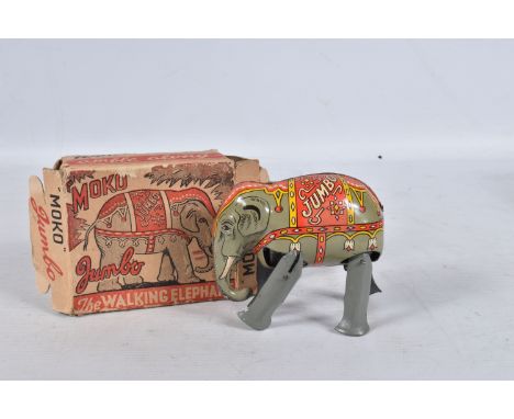 A BOXED MOKO JUMBO THE WALKING ELEPHANT WIND UP TIN PLATE TOY, grey body with a decorative faded red and yellow patterned det