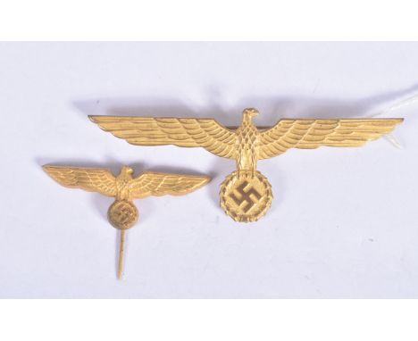 TWO NAZI GERMANY EAGLE PIN BADGES, the first is a stick pin and the second is an officers cap badge, both are gold in colour 