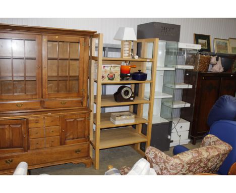 A pair of light wood five tier display shelves