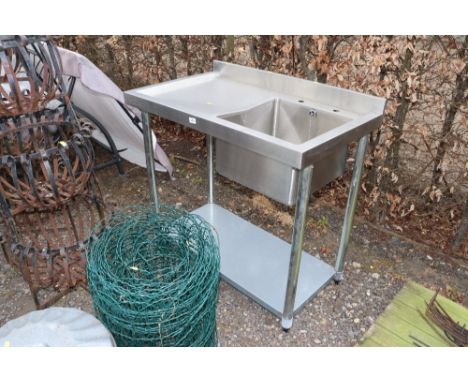 A stainless steel sink unit fitted shelf beneath (manual with Auctioneer)