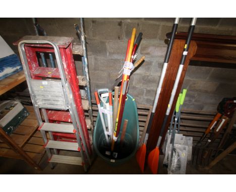A plastic pull-along garden bucket and quantity of tools to include shears, a Wolf Tools scraper, digging fork etc.