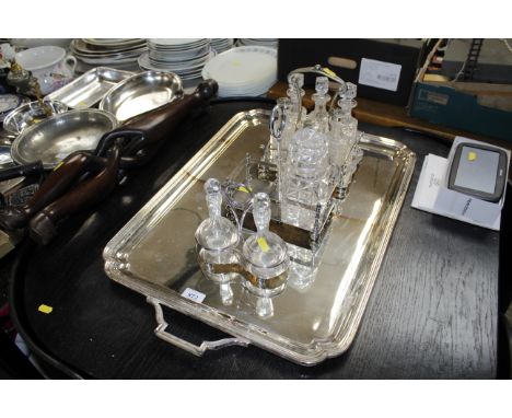 A silver plate and glass cruet, some with silver tops, a silver plated stand with two glass oil bottles, a silver plated twin