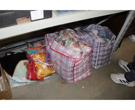 A quantity of various textiles, throws and curtains etc