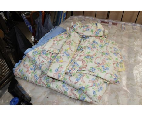 A pair of curtains with tie backs and pelmet, a duvet