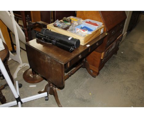 A reproduction drop leaf mahogany sofa table