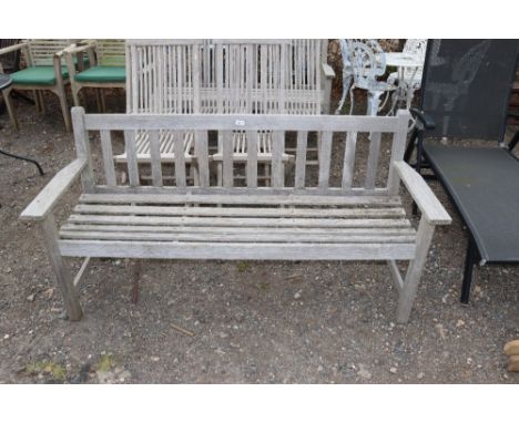 A teak three seater garden bench