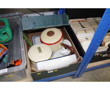 A box containing various enamel ware and a wall shelf