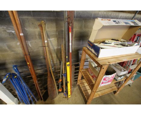 A quantity of tools to include a Wolf Tools three prong hoe, a spirit level, sash clamps, etc.