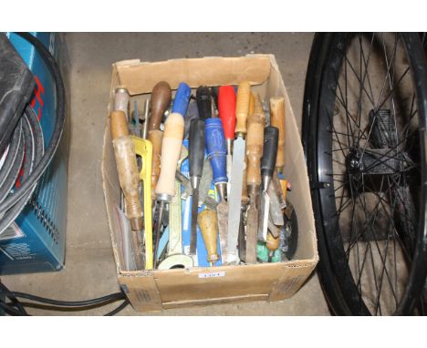 A box containing a large quantity of hand tools to include chisels, spanners, various fixings, etc.