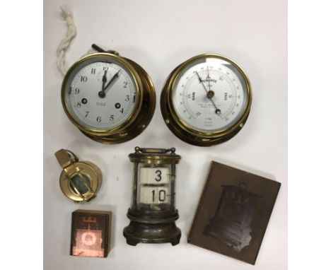 A brass cased ship's style wall clock by Sestrel 14.5 cm diameter, a similar matching barometer bearing retailer's stamp "Hen