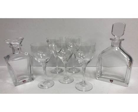 Two modern Orrefors decanters, a set of five Kosta Boda wine glasses, a glass handkerchief vase, Mats Jonasson glass paperwei