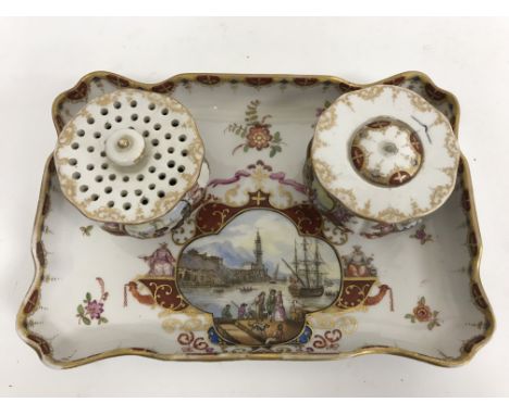 A circa 1900 Dresden porcelain ink stand of rectangular form with shaped edge decorated with panel of quayside scene with fig