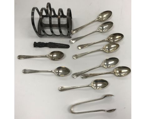 A collection of silver comprising a set of nine silver teaspoons and a pair of matching sugar tongs together with a silver bo