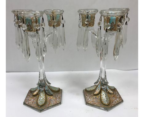 A collection of items to include a pair of early 20th Century glass candelabra with lustres and later painted decoration, 27 