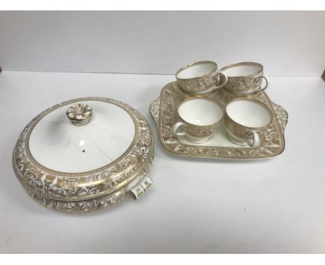 A Wedgwood "Gold Florentine" design dinner service / tea set, 43 pieces total including three sizes of plates, cups, saucers,