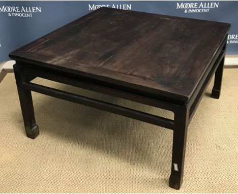A circa 1900 Chinese hardwood low table, the plank top on square legs united by upper stretchers on scroll feet 89 cm x 89.5 