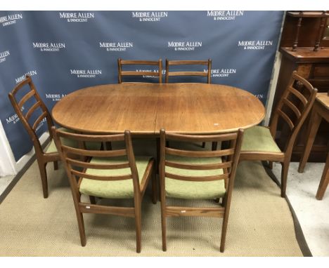 A Meredew oak D end extending dining table 204 cm x 88 cm x 74 cm  high together with a set of six G Plan teak ladder back di