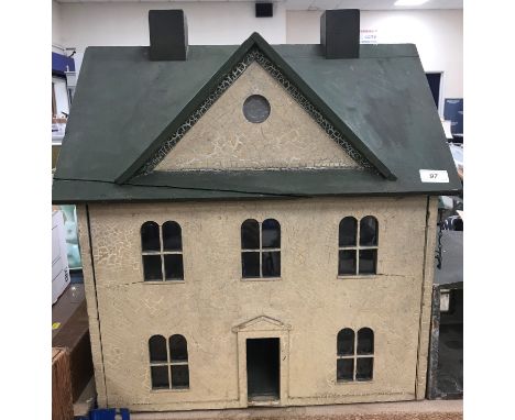 A circa 1890 late Victorian doll's house with painted green roof and pebble dash style exterior, 56 cm wide x 44 cm deep x 62