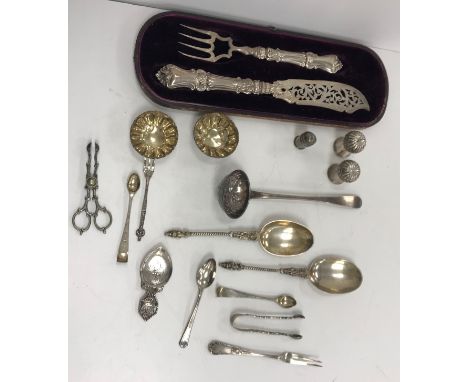 A pair of 19th Century Continental fruit spoons with figural decorated handles, a pair of thistle peppers, sifter ladle, pair
