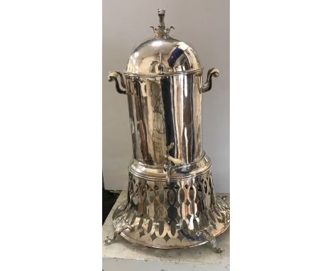 A late Victorian silver plated samovar or tea urn of cylindrical form, the dome top with demi-gryphon and ducal crown finial,