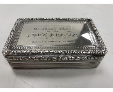 A George IV silver presentation snuff box of rectangular form, with engine-turned and reeded decoration, the top and base wit