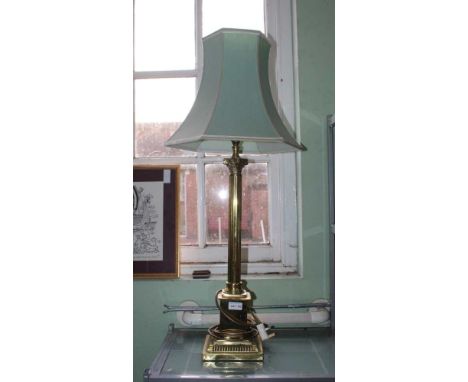 A CLASSICAL COLUMNED BRASS TABLE LAMP with shade65cm to light bulb fitting, bottom edge slightly bent throughout, needs a goo