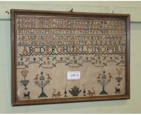 A 19TH CENTURY NEEDLEWORK SAMPLER with alphabet above a band of stylised animals and plants, 22cm x 32cm, framed and glazed 