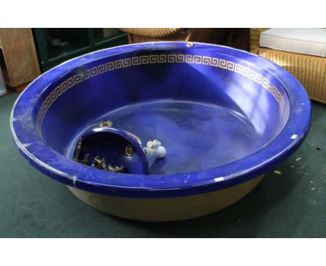 A TWO-PIECE BLUE AND GILT GREEK KEY BANDED WASH SUITE comprising large circular bath, oval hand basin, and a selection of gil