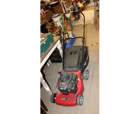 A MOUNTFIELD PETROL DRIVEN LAWNMOWER with a Briggs &amp; Stratton 450 series E powered engine, complete with grass collection