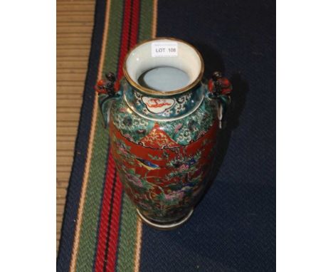 A 20TH CENTURY JAPANESE CERAMIC VASE, moulded mask handles, enamelled to one side with courtly figures in landscape and to th