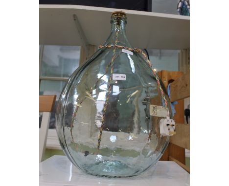 A LARGE CARBOY STYLE GLASS BASED LAMP 