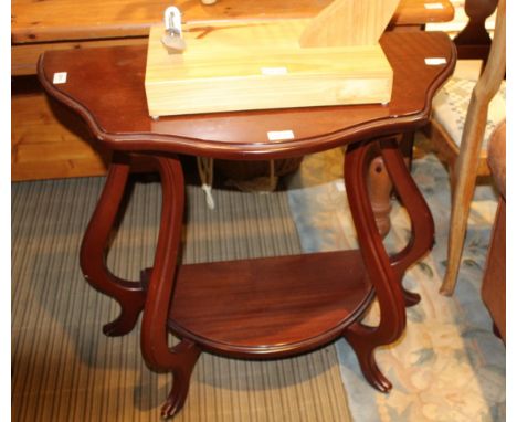 A MODERN MAHOGANY FINISHED DEMI-LUNE TWO TIER CONSOLE TABLE together with a bergere backed armchair 