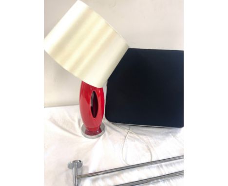 Red standard lamp, wheelchair cushion, metal towel rail 