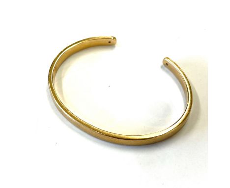 9ct gold and diamond bangle estimate 0.25 diamond, approximate weight 17.5g 