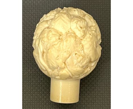 Bone carved stick head depicting lions, approximate measurements: 2 inches 