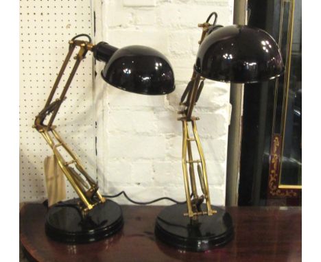 DESK STUDY LAMPS, a pair, anglepoise design, brass and black enamel, 64cm H maximum. 