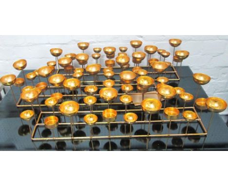 TEA LIGHTER HOLDERS, a set of three, in gold finish. (3)
