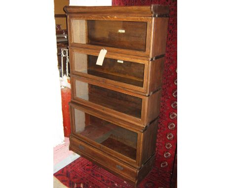 GLOBE WERNICKE BOOKCASE, early 20th century, vintage oak with four stacking sections, each with rising glazed doors, 147cm H 