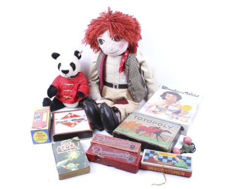A collection of assorted vintage toys. Including a 'Jim' rag doll and Steiff Panda Bao Bao bear, board games, etc. 