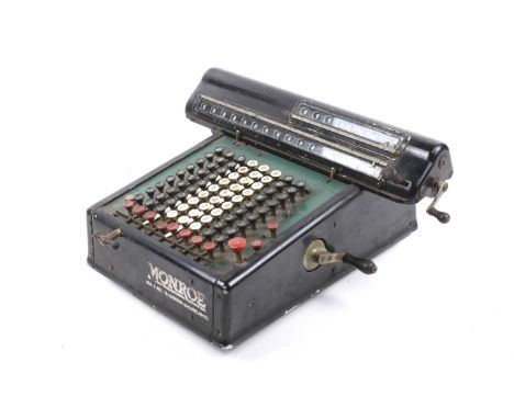 A vintage Monroe mechanical calculator. H19cm
