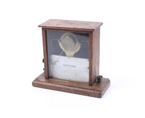 Scientific lab instrument: a vintage wood cased ammeter. With a glass front and painted gauge showing 0 to 3 Amperes. H17cm. 
