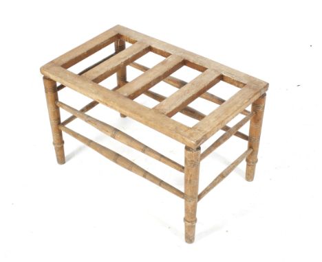A vintage pine luggage rack. Raised on turned supports united by stretchers, H44cm x W69.5cm x D41.5cm