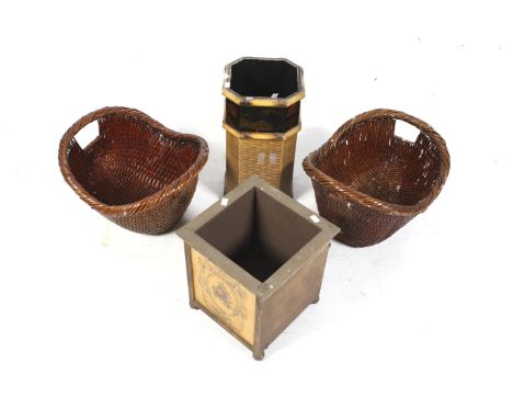 A planter, umbrella stand and two wicker baskets. The planter of cube form with a painted decorative front panel supported on