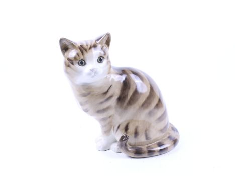 A vintage Just Cats ceramic figure. In a seated position with glass eyes, H27.5cm