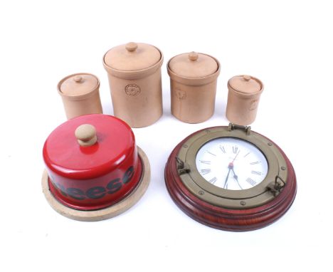 An assortment of kitchenalia and a wall clock. Comprising a red enamel dish marked 'Cheese' Enamel cheese dish, a set of Conf