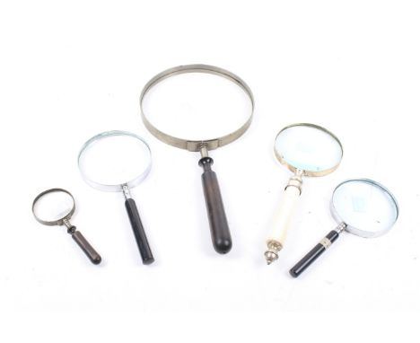 Five vintage magnifying glasses. Largest 36cm